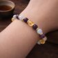 Handcrafted gemstone bracelet showing careful assembly and gold accents