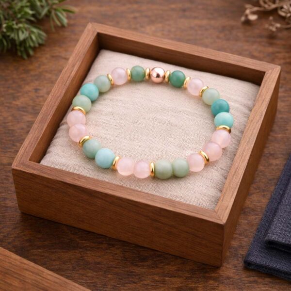 Love and connection gemstone bracelet displayed in a wooden box with rose quartz, amazonite, and green aventurine beads love-connection-gemstone-bracelet-wooden-box-display.jpg