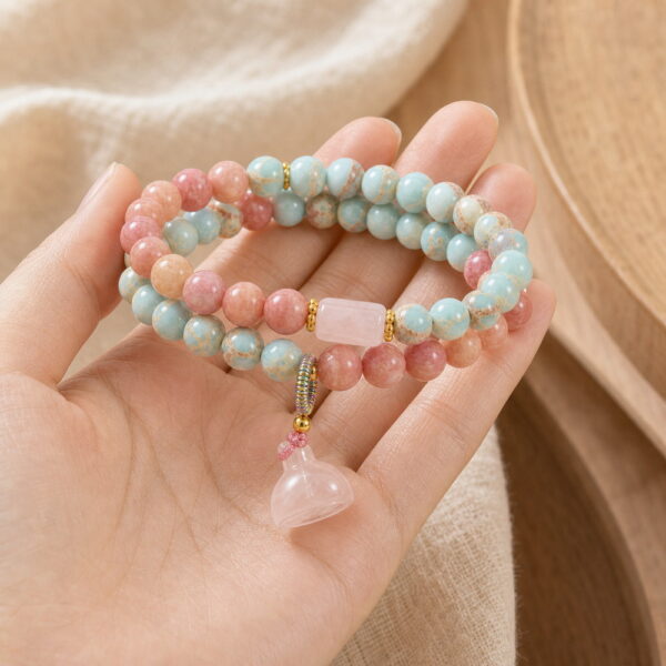 Blush Harmony Double-Wrap Stone Bracelet - Handheld Blush Harmony Double-Wrap Stone Bracelet, product held naturally in one hand