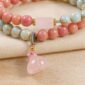 Blush Harmony Double-Wrap Stone Bracelet, close detail of beads, centerpiece, cord, and drop