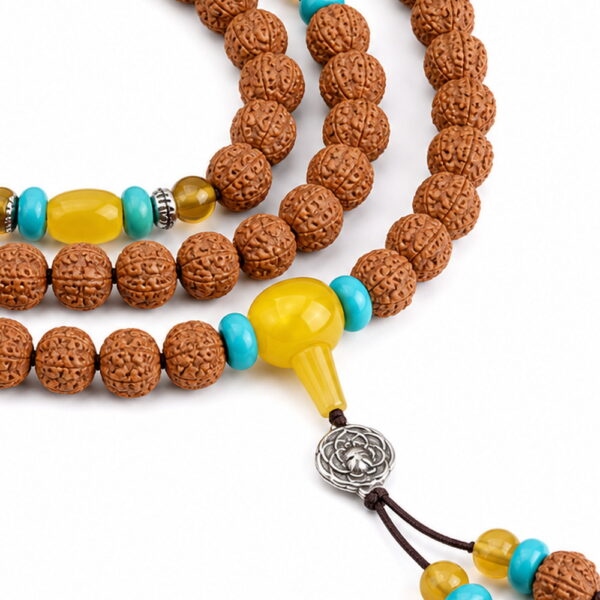 Bright Horizon 108-Bead Bodhi Seed Mala - Detail Bright Horizon 108-Bead Bodhi Seed Mala, close detail of seed texture, accent beads, connector, and drop