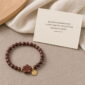 Deep Blossom Rosewood Bracelet, product on premium textile with a meaning card