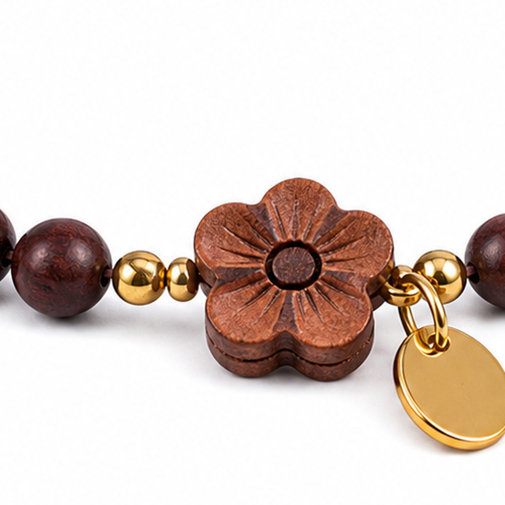 Deep Blossom Rosewood Bracelet, close detail of beads, centerpiece, cord, and drop