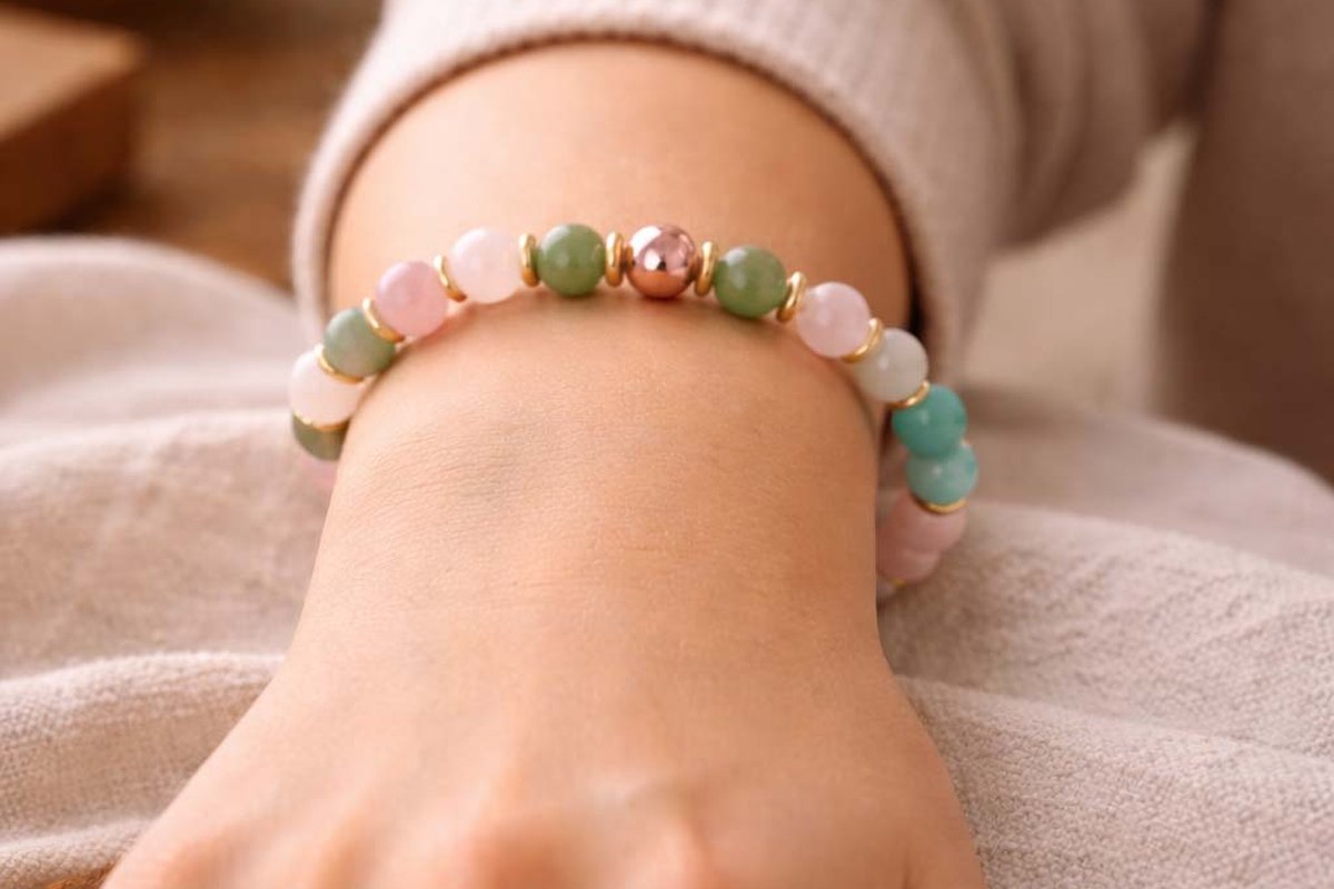 Eastern Story Love and Connection bracelet worn on the wrist with rose quartz, amazonite, and green aventurine beads