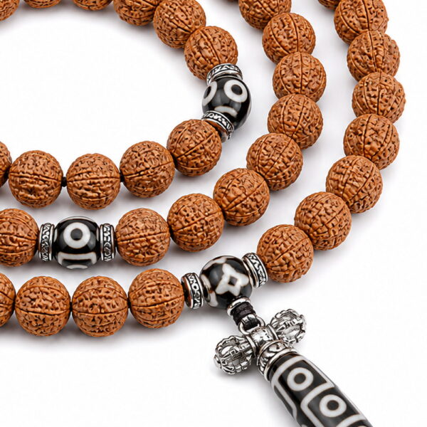 Enduring Blessing 108-Bead Bodhi Seed Mala - Detail Enduring Blessing 108-Bead Bodhi Seed Mala, close detail of seed texture, accent beads, connector, and drop