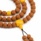 Golden Harvest 108-Bead Bodhi Seed Mala, close detail of seed texture, accent beads, connector, and drop