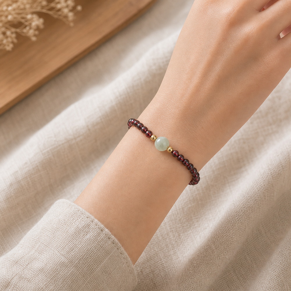 Quiet Glow Garnet & Pale Stone Bracelet, faceless natural wrist wearing the product