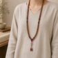 Red Harmony 108-Bead Bodhi Seed Mala, faceless long-necklace view from collarbone to waist