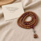 Red Harmony 108-Bead Bodhi Seed Mala, mala on premium textile with a meaning card