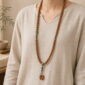 Steady Ascent 108-Bead Bodhi Seed Mala, faceless long-necklace view from collarbone to waist
