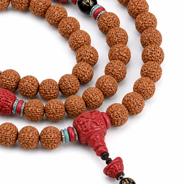 Steady Flow 108-Bead Bodhi Seed Mala - Detail Steady Flow 108-Bead Bodhi Seed Mala, close detail of seed texture, accent beads, connector, and drop