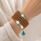 Still Waters 108-Bead Bodhi Seed Mala, faceless multi-wrap wrist view