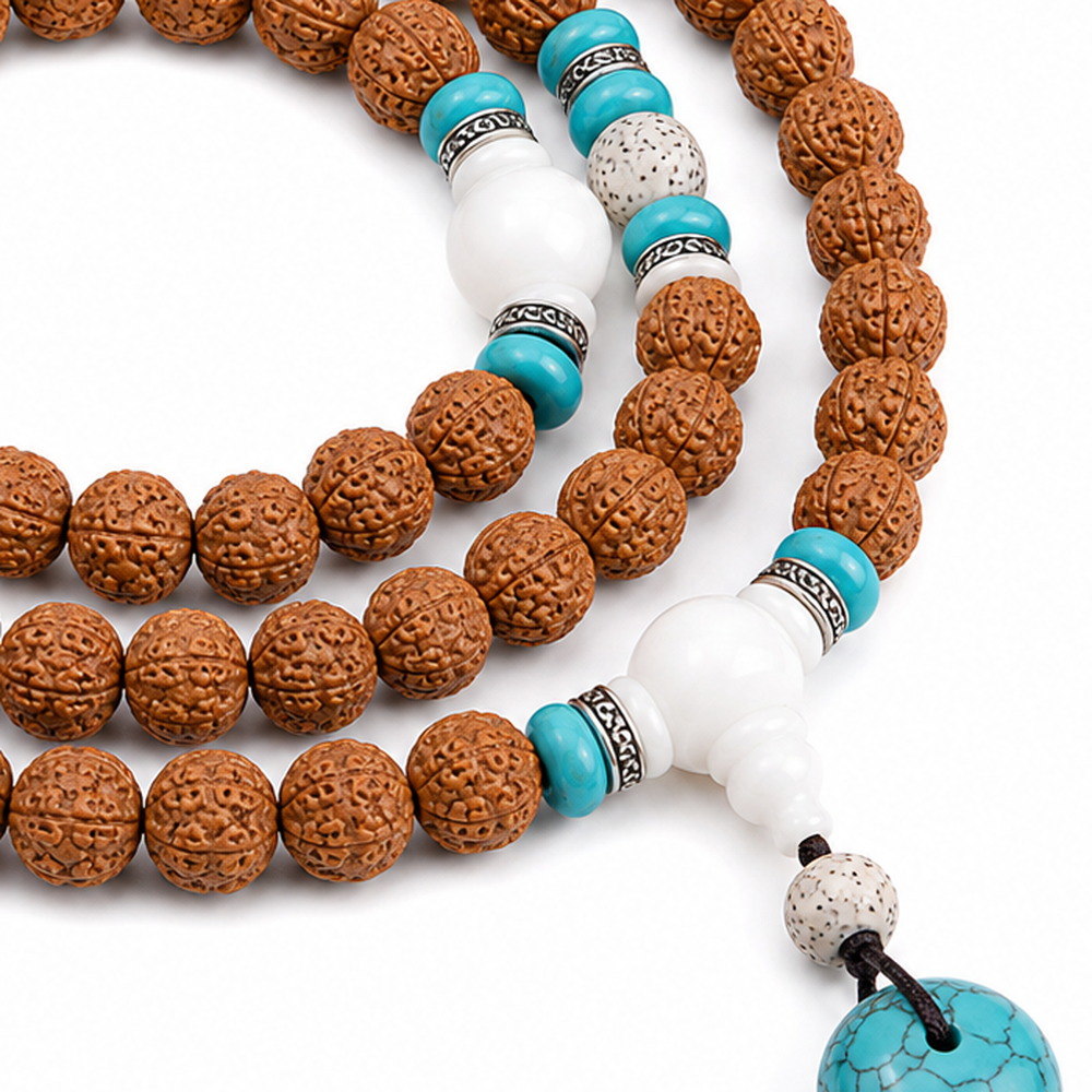 Still Waters 108-Bead Bodhi Seed Mala, close detail of seed texture, accent beads, connector, and drop