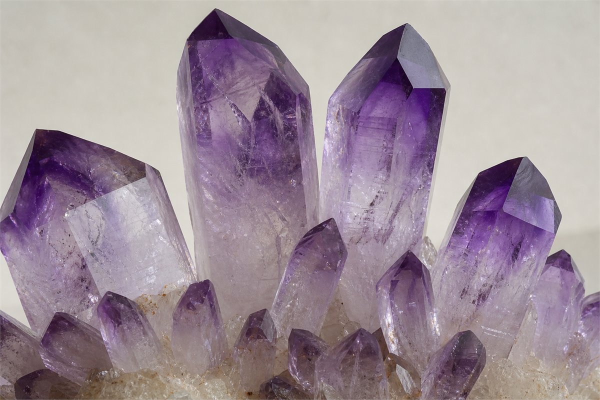 Macro of amethyst points with uneven purple and colorless zones