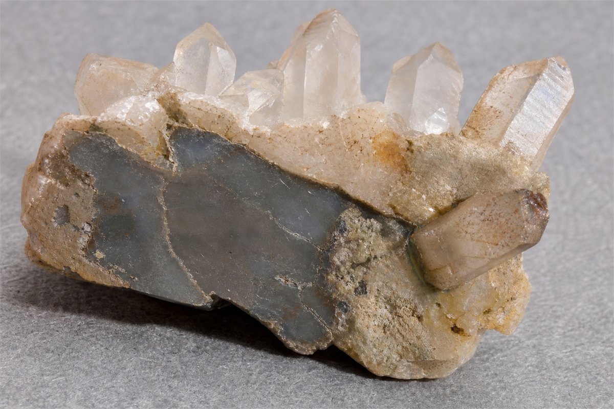 Underside of an assembled quartz cluster with subtle adhesive seams and a mismatched attached point