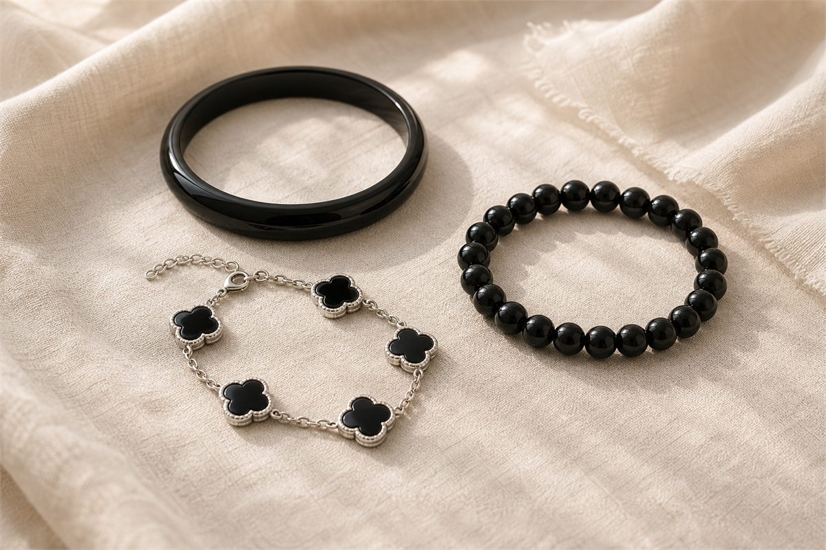 Solid black agate bangle, round bead bracelet, and generic five-motif black stone bracelet