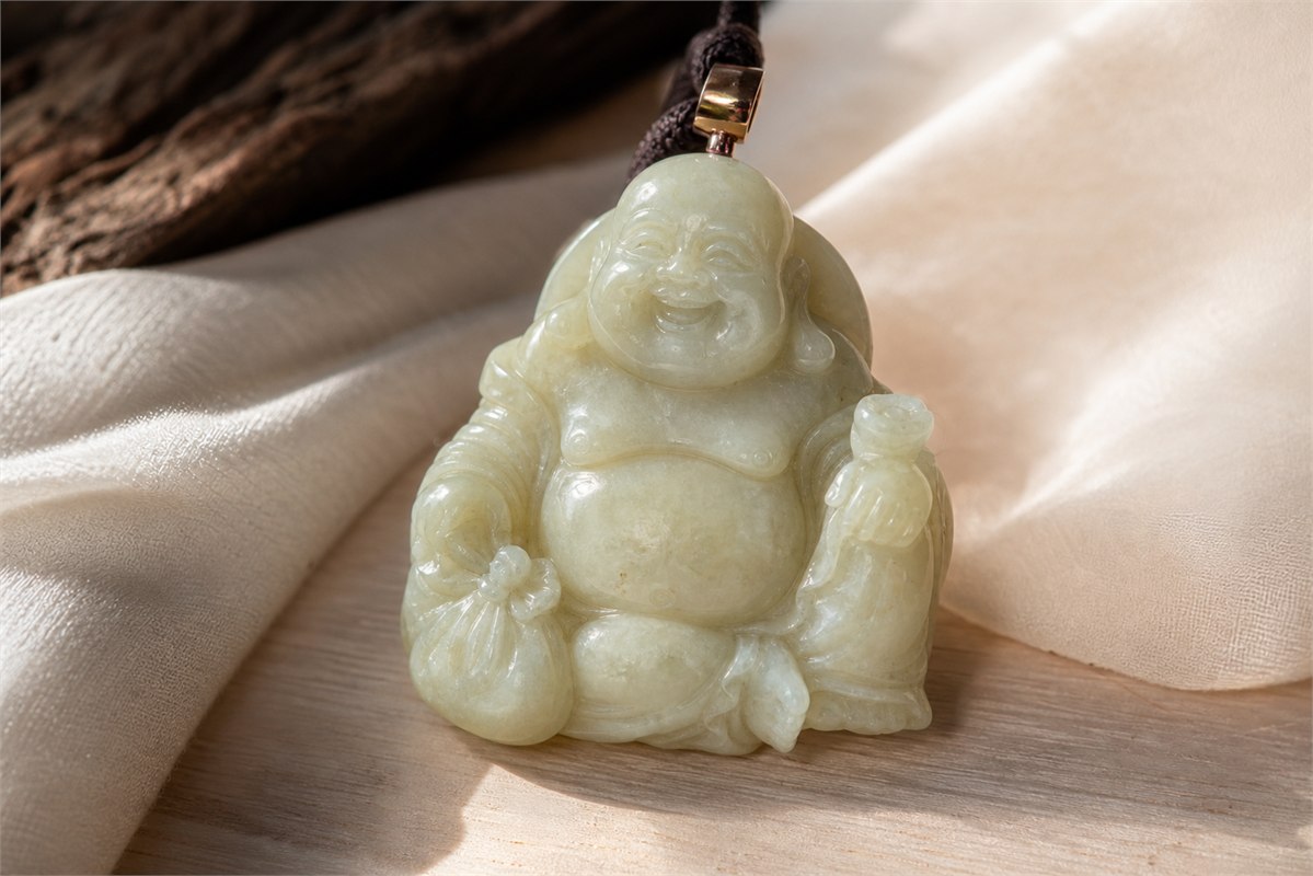 Smiling Budai-inspired jade pendant with a cloth sack and open robe