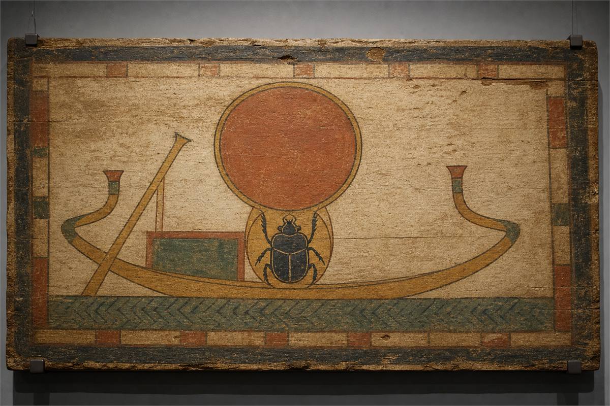Painted funerary panel with a scarab beneath a solar disk inside a simple solar boat