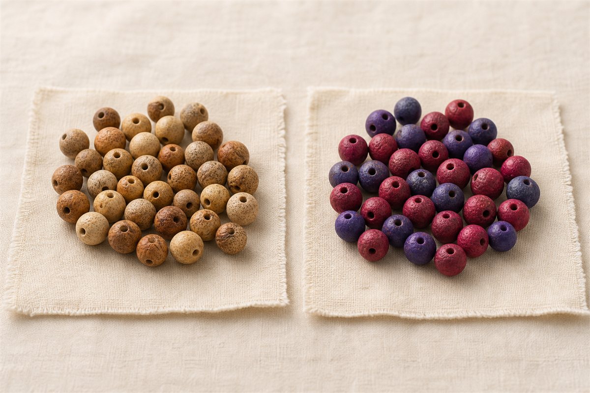 Naturally varied brown Bodhi beads beside uniformly red and purple dyed beads