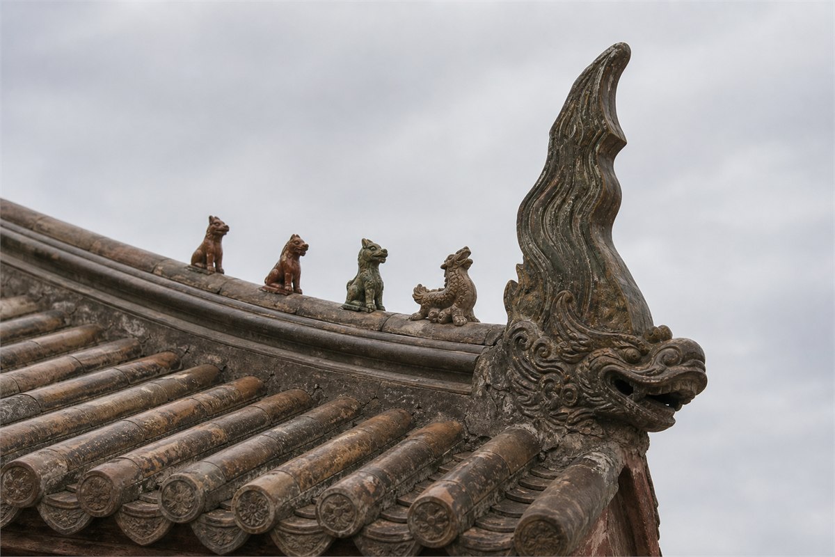 Traditional tiled roof ridge with small ceramic beasts and a dragon-fish Chiwen end form