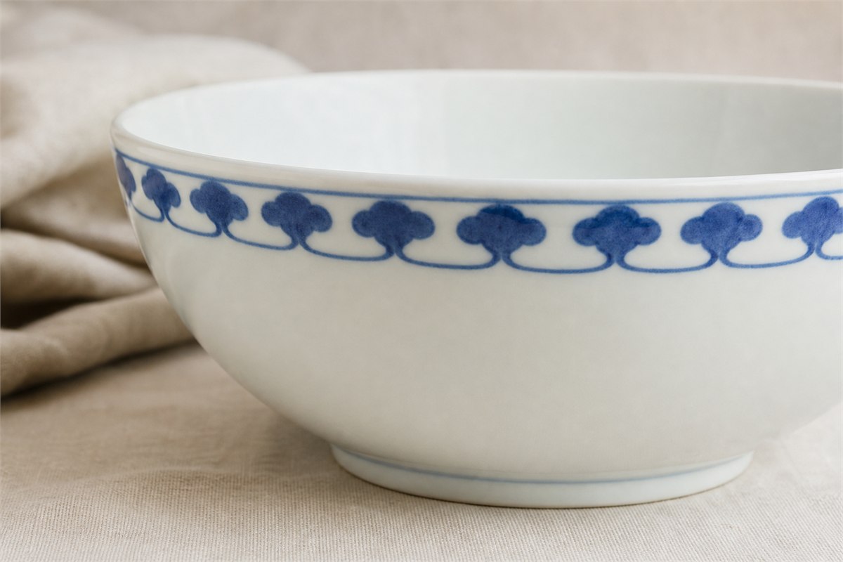 Cobalt ruyi-head border repeated around the rim of a white porcelain bowl