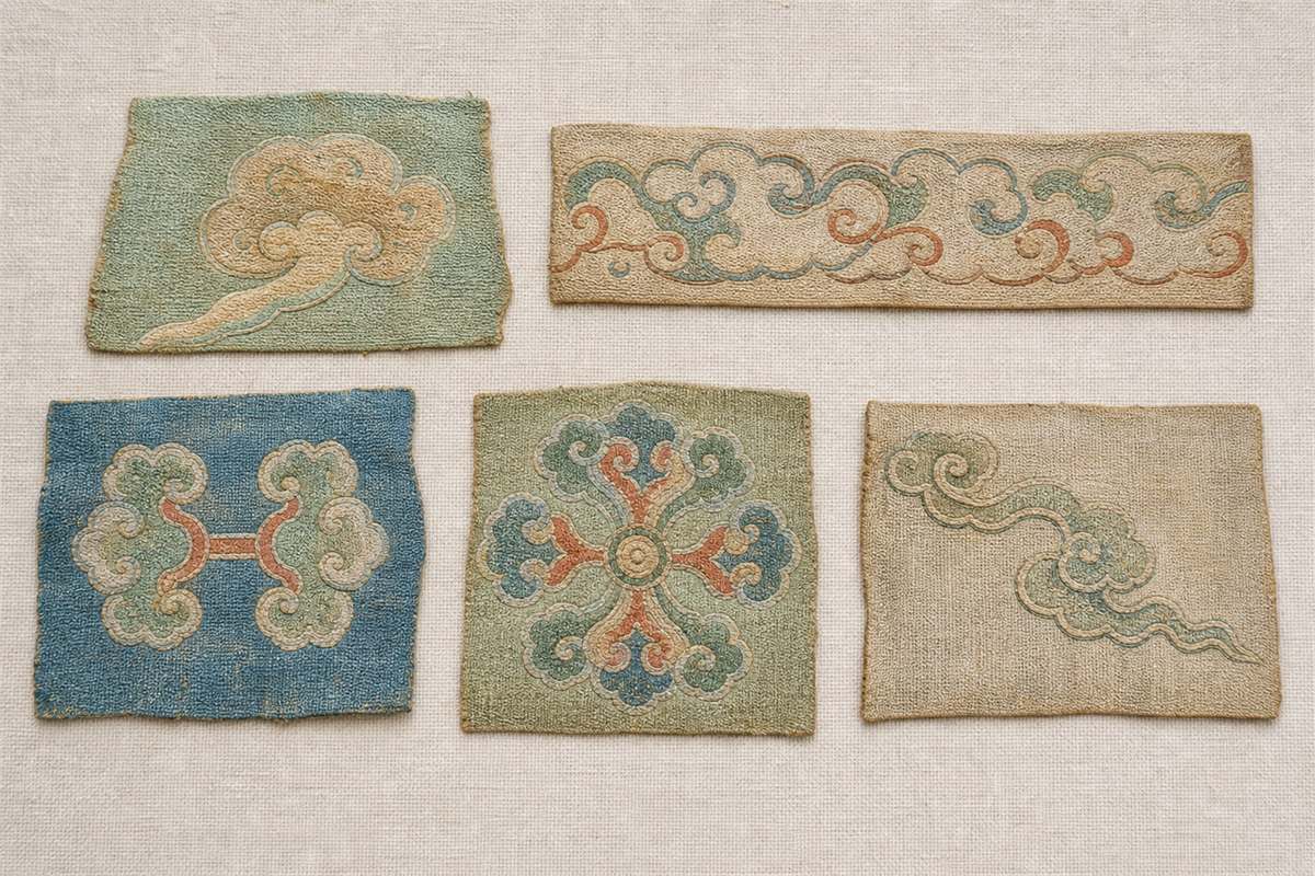 Five woven textile fragments with different ruyi-cloud arrangements and tails