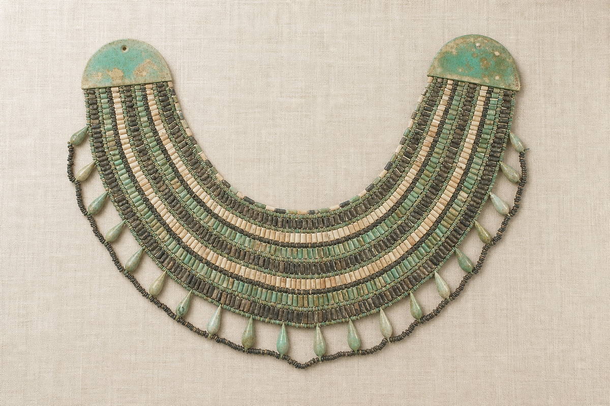 Complete wesekh broad collar with multiple blue-green faience rows, side end pieces, and drop border