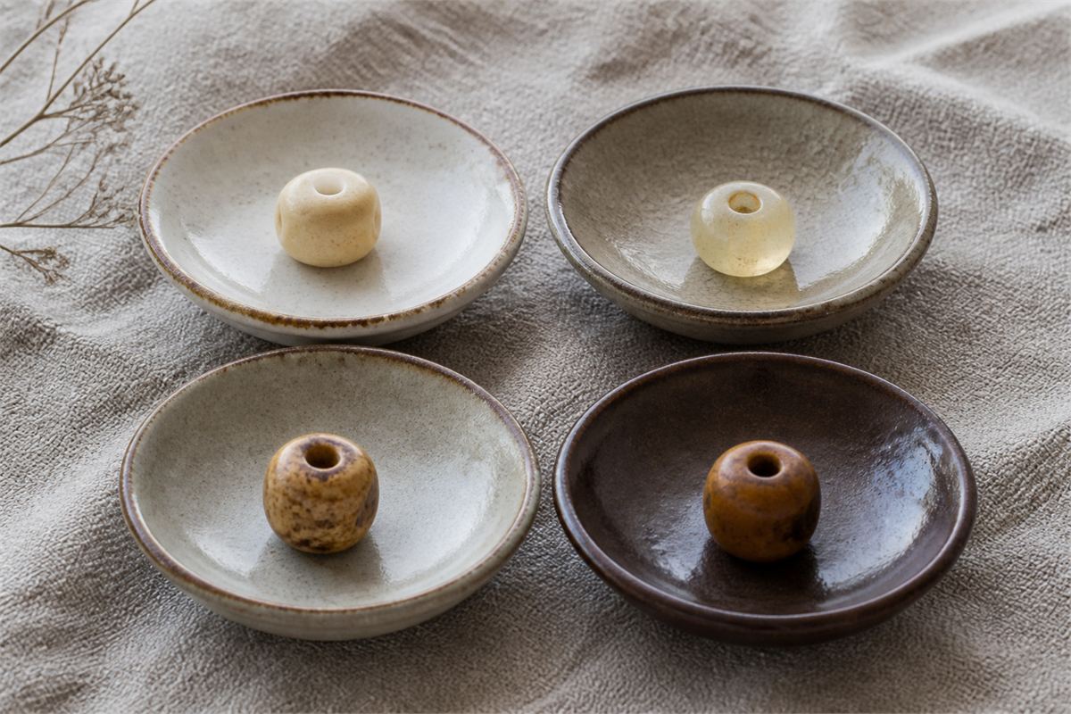 Several clean processed bone beads with cream, honey, mottled, and lightly stained appearances