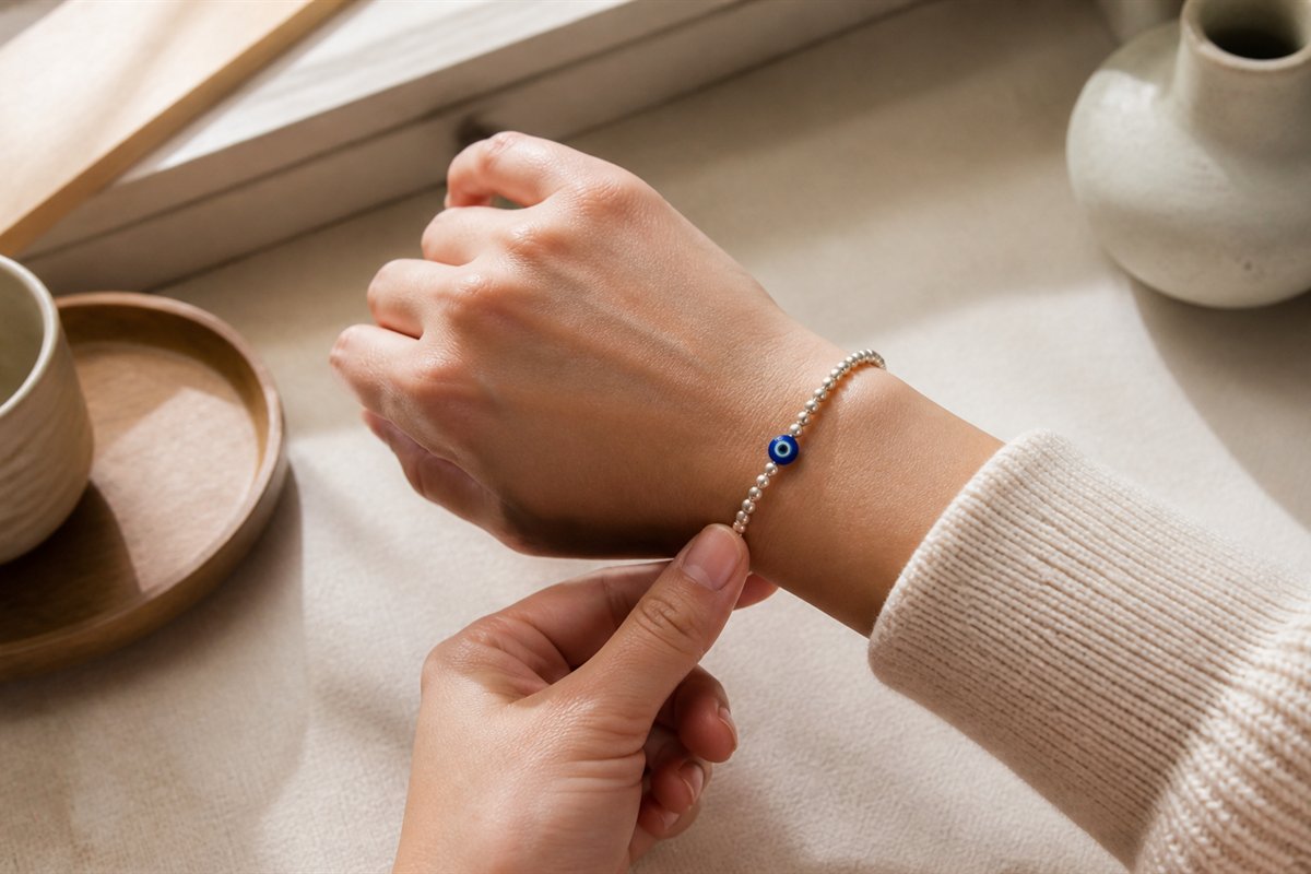 A relaxed wrist wearing a well-fitted bead bracelet with room for natural movement.