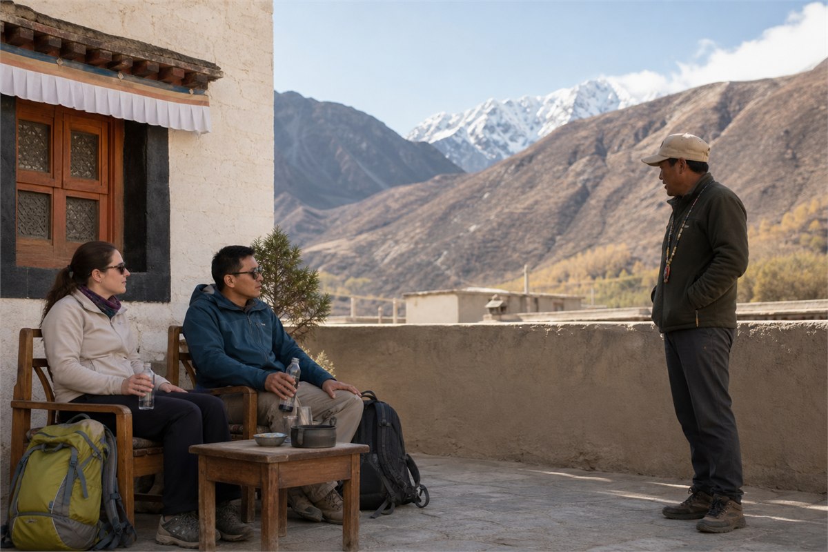Two travelers resting with water in a guesthouse courtyard while a local guide checks on them