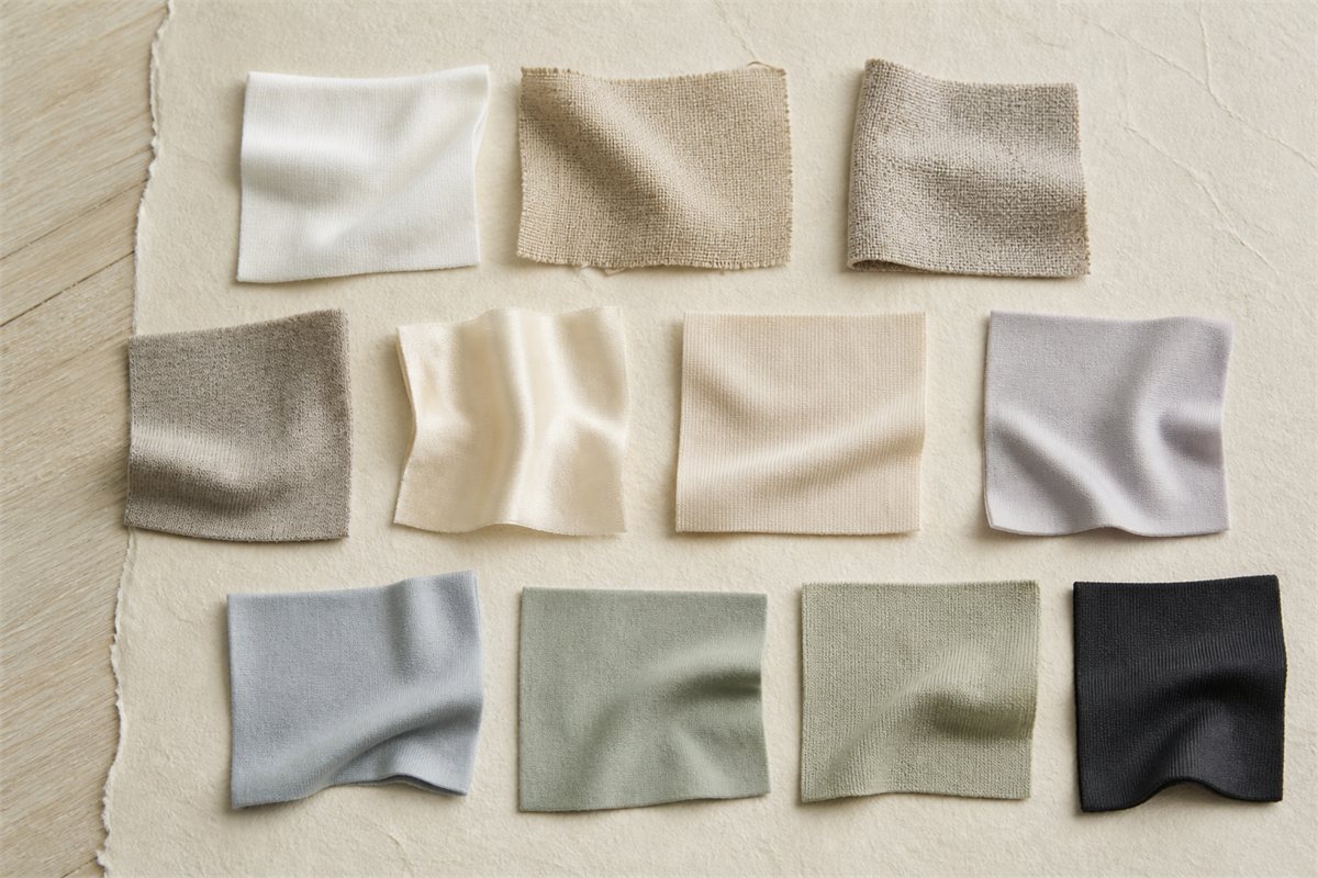 Eleven unlabeled fabric swatches with varied woven, knitted, smooth, and stretch textures
