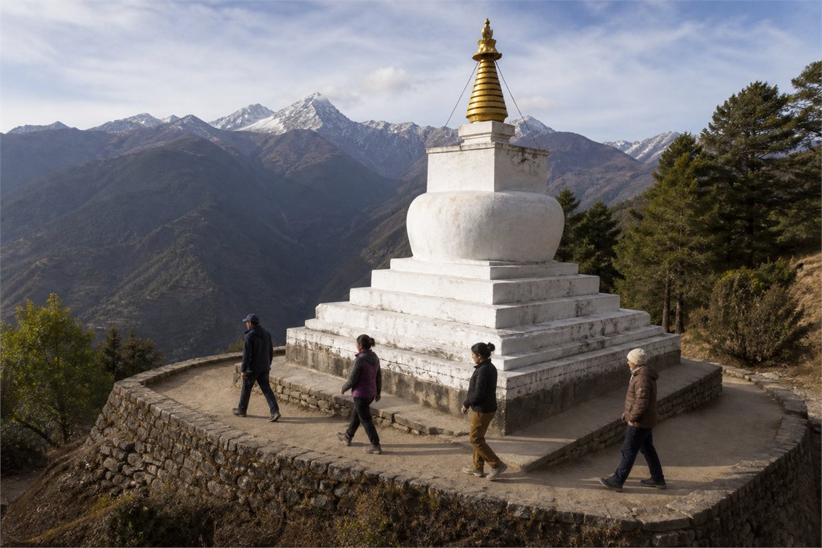 Visitors walking calmly around a white Tibetan chorten on a clear mountain path