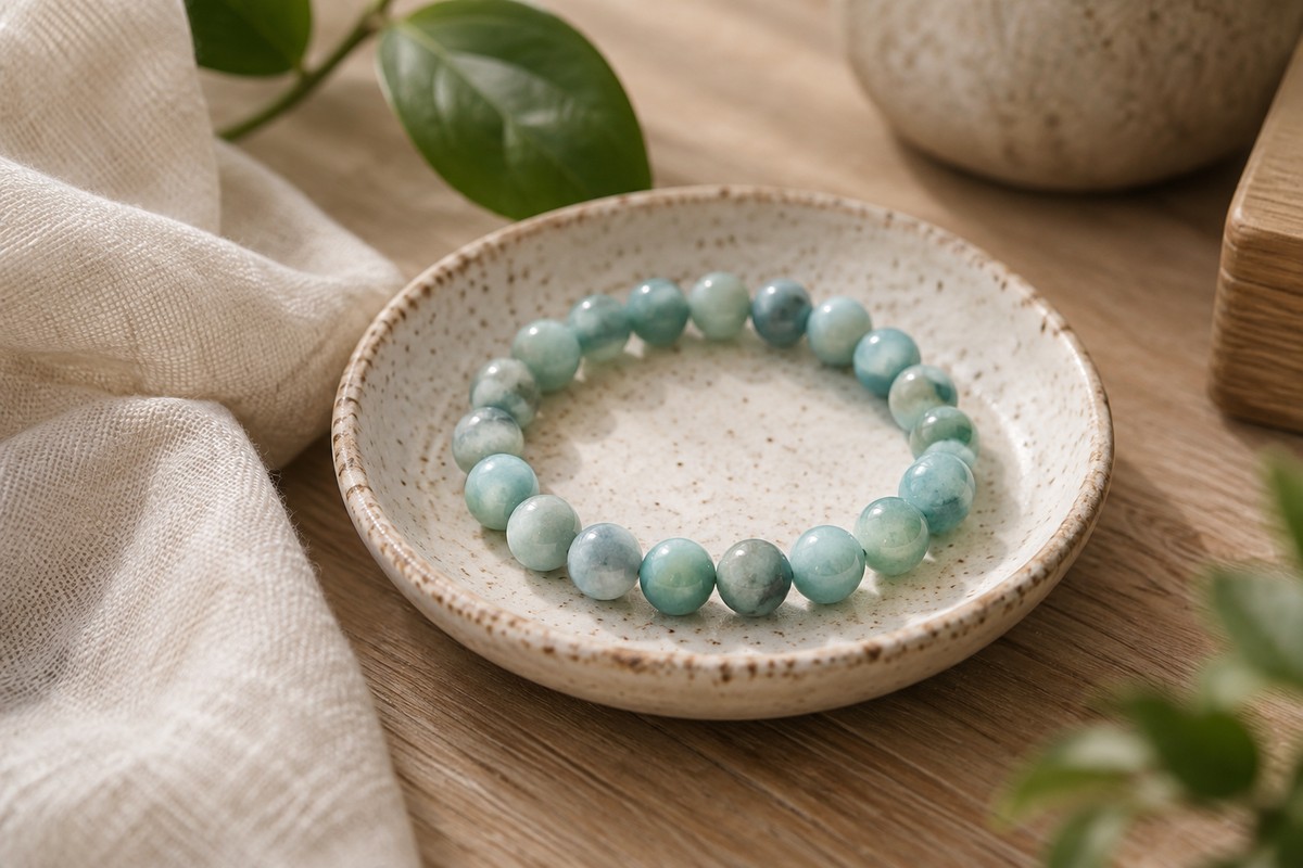 Blue-green amazonite bead bracelet in a ceramic dish