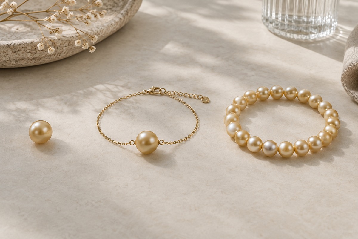 Loose golden pearl, single-pearl chain bracelet, and full pearl strand.