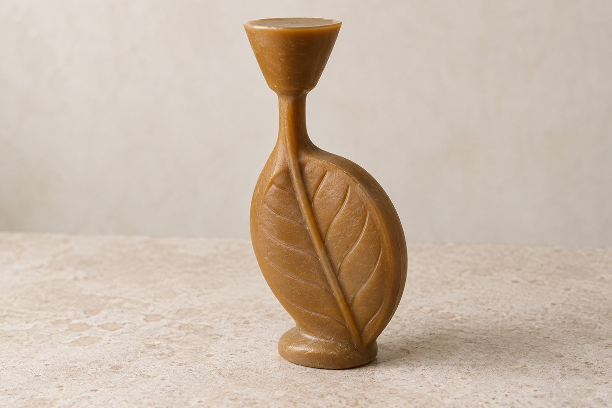 Upright wax leaf connected to a thick stem and a solid flared wax form.