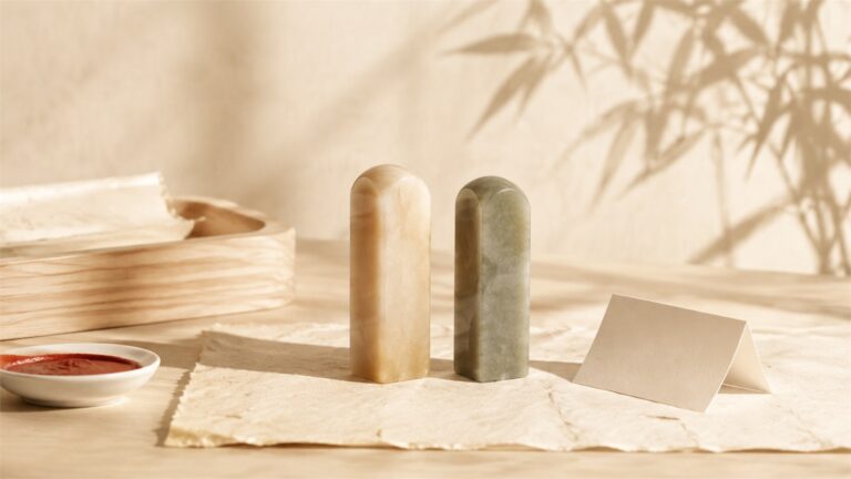 Two coordinated Chinese stone seals on warm handmade paper